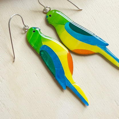 side view of handmade australian orange-bellied parrot earrings