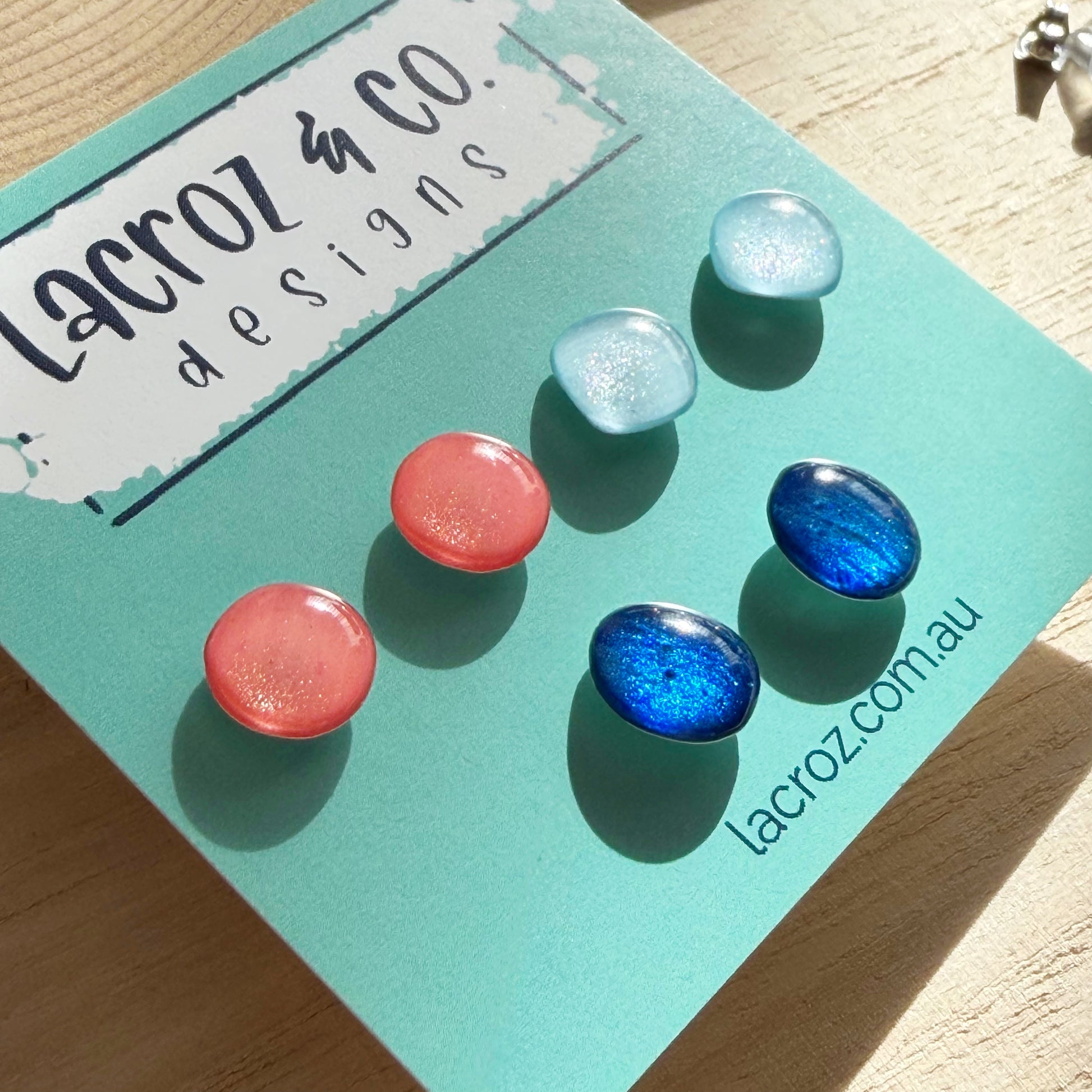 Set of colorful earrings on a Lacroz & Co. Designs card.